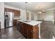 Open concept kitchen with island, stainless steel appliances, and seamless flow to living spaces at 2780 Cormorant Dr, Greenwood, IN 46143