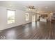 Expansive living room showcasing hardwood floors, access to the kitchen, and natural lighting at 2780 Cormorant Dr, Greenwood, IN 46143