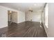 Open-concept living room with hardwood floors, neutral paint, and an abundance of natural light at 2780 Cormorant Dr, Greenwood, IN 46143
