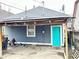 Backyard featuring a house with a turquoise door and a dumpster at 309 N Forest Ave, Indianapolis, IN 46201