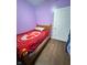 Cozy bedroom with a full-size bed, wood floors, and a door leading to a closet space, a private retreat at 309 N Forest Ave, Indianapolis, IN 46201