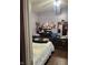 Bedroom with furnishings, including a bed, dresser, shelves, and assorted decor at 309 N Forest Ave, Indianapolis, IN 46201