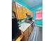 Functional kitchen with wooden cabinetry, white countertops, offering a practical space for meal preparation at 309 N Forest Ave, Indianapolis, IN 46201