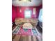 Inviting living room with comfortable seating, a colorful rug, and a cozy atmosphere for relaxation and gatherings at 309 N Forest Ave, Indianapolis, IN 46201