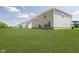 Expansive backyard with lush green grass, showcasing the home's exterior at 3256 Fawn Cir, Brownsburg, IN 46112