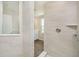 Bright bathroom featuring tiled shower with view to modern vanity at 3256 Fawn Cir, Brownsburg, IN 46112