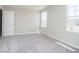 Inviting carpeted bedroom with ample natural light from two windows at 3256 Fawn Cir, Brownsburg, IN 46112