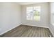 Bright bedroom with hardwood flooring and natural light from the window overlooking a home at 3256 Fawn Cir, Brownsburg, IN 46112