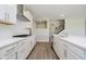 Modern kitchen with white cabinets, stainless steel appliances, and an open layout to the stairs at 3256 Fawn Cir, Brownsburg, IN 46112