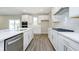 Modern kitchen featuring white cabinets, stainless steel appliances, and a spacious layout at 3256 Fawn Cir, Brownsburg, IN 46112
