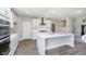 Kitchen features a large island with white countertop and stainless steel appliances at 3256 Fawn Cir, Brownsburg, IN 46112