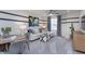 Cozy loft space featuring a modern sofa, round table, and media cabinet for relaxed living and entertainment at 3256 Fawn Cir, Brownsburg, IN 46112