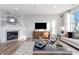 Bright living room with a fireplace, modern furniture, large windows, and open-concept design at 3256 Fawn Cir, Brownsburg, IN 46112