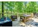 Relaxing outdoor deck area with comfortable seating and wooded views at 3273 Bailey Dr, Morgantown, IN 46160