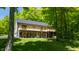Backyard featuring a spacious deck, lush greenery, and ample space for outdoor enjoyment at 3273 Bailey Dr, Morgantown, IN 46160