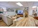 Inviting finished basement with a cozy couch, accent furniture, and a large screen television at 3273 Bailey Dr, Morgantown, IN 46160
