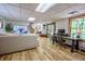 Spacious finished basement with a comfortable couch, desk, and access to an outdoor area at 3273 Bailey Dr, Morgantown, IN 46160