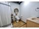 Functional bathroom featuring a toilet, vanity, shelving, and a shower with curtain at 3273 Bailey Dr, Morgantown, IN 46160