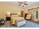 Inviting primary bedroom with accent furniture, neutral decor, and plush carpeting at 3273 Bailey Dr, Morgantown, IN 46160