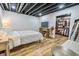 Cozy bedroom featuring wood floors, a comfortable bed, and an adjacent walk-in closet at 3273 Bailey Dr, Morgantown, IN 46160