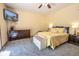 Bright primary bedroom featuring warm colors, soft carpet and natural light at 3273 Bailey Dr, Morgantown, IN 46160