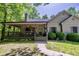 Welcoming home with a covered porch, 'Welcome' sign, and neat landscaping at 3273 Bailey Dr, Morgantown, IN 46160