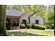 Inviting home featuring a covered front porch, manicured bushes, and a welcoming entrance at 3273 Bailey Dr, Morgantown, IN 46160