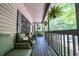 Charming front porch with comfortable seating, lush foliage, and a welcoming ambiance at 3273 Bailey Dr, Morgantown, IN 46160