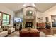 Cozy living room with brick fireplace, wood accents, and ample natural light at 3273 Bailey Dr, Morgantown, IN 46160