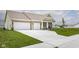 Inviting single-Gathering home with a spacious driveway, a two-car garage, and a beautifully landscaped front yard at 3622 S Setting Sun Ln, New Palestine, IN 46163