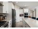 A spacious kitchen with stainless steel appliances, modern lighting, and ample counter space at 3622 S Setting Sun Ln, New Palestine, IN 46163