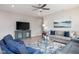 Inviting living room with modern decor and a comfortable seating area, perfect for relaxation at 3622 S Setting Sun Ln, New Palestine, IN 46163