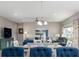 A cozy living room and dining area with comfortable seating and modern decor at 3622 S Setting Sun Ln, New Palestine, IN 46163