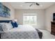 Comfortable main bedroom featuring natural light and a cozy queen-size bed at 3622 S Setting Sun Ln, New Palestine, IN 46163