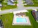 Overhead view of a sparkling blue community pool with surrounding lounge chairs and amenities at 3622 S Setting Sun Ln, New Palestine, IN 46163