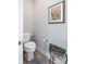 Convenient powder room featuring modern fixture and a decorative wrought iron stand at 3622 S Setting Sun Ln, New Palestine, IN 46163