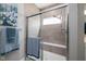 Walk-in shower featuring modern tile and a built-in bench at 3622 S Setting Sun Ln, New Palestine, IN 46163