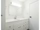 Bright bathroom features a sink with a modern faucet and a quartz countertop at 370 N Bazil Ave, Indianapolis, IN 46219