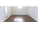 Empty bedroom featuring hardwood floors, fresh paint, and natural light at 370 N Bazil Ave, Indianapolis, IN 46219