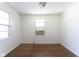 Bright bedroom with hardwood floors and a window providing ample natural light at 370 N Bazil Ave, Indianapolis, IN 46219