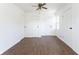Empty bedroom featuring hardwood floors, fresh paint, and multiple closets at 370 N Bazil Ave, Indianapolis, IN 46219