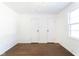 Bright bedroom features hardwood floors, fresh paint, and double door closet at 370 N Bazil Ave, Indianapolis, IN 46219