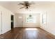 Bright living room with hardwood floors, ceiling fan, and natural light at 370 N Bazil Ave, Indianapolis, IN 46219
