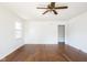 Empty living room featuring beautiful hardwood floors and neutral walls at 370 N Bazil Ave, Indianapolis, IN 46219