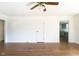 Spacious living room featuring hardwood floors and access to the kitchen at 370 N Bazil Ave, Indianapolis, IN 46219