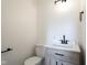 Stylish powder room with sleek vanity, modern lighting, and neutral decor at 370 N Bazil Ave, Indianapolis, IN 46219