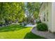 Expansive backyard with mature trees, patio area, and lush green lawn at 3781 S Station Dr, Columbus, IN 47203
