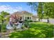 Beautiful backyard featuring patio, green grass, landscaping and privacy fence at 3781 S Station Dr, Columbus, IN 47203