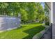 Spacious backyard featuring a well-maintained lawn, shed, and mature trees at 3781 S Station Dr, Columbus, IN 47203