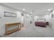 Spacious finished basement with neutral carpet, bedroom and bathroom access at 3781 S Station Dr, Columbus, IN 47203